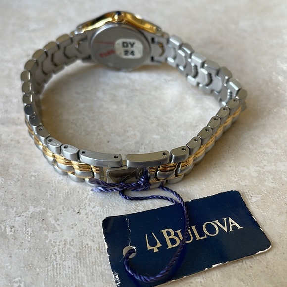 COPY - Bulova lady battery water resistant 30m silver and gold w/date